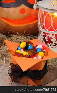 box filled with a variety of sweets on the table for Halloween