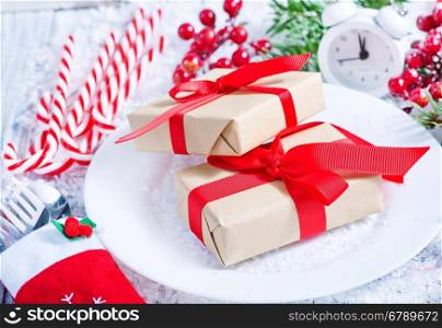 box for present and christmas decoration on a table