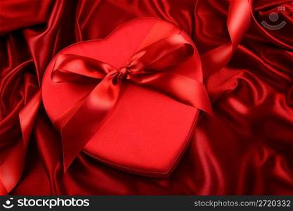 Box of chocolate on red satin