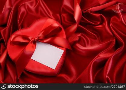 Box of chocolate with red ribbon
