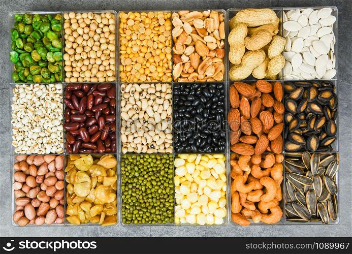 Box of different whole grains beans and legumes seeds lentils and nuts colorful snack texture background / Collage various beans mix peas agriculture of natural healthy food for cooking ingredients