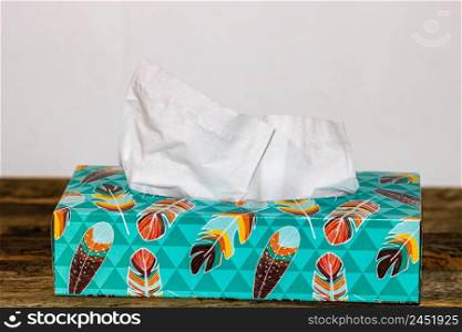Box of white paper tissues on table
