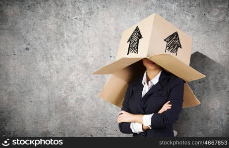 Box on head. Funny businesswoman with carton box on head