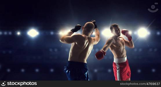 Box professional match. Two professional boxers are fighting on arena panorama view