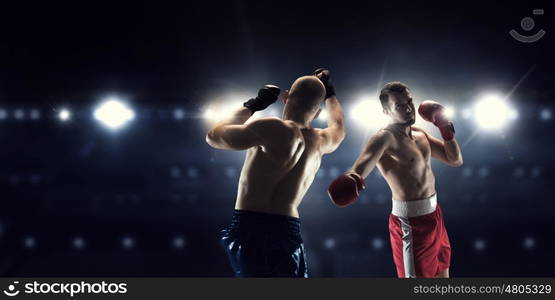 Box professional match. Two professional boxers are fighting on arena panorama view