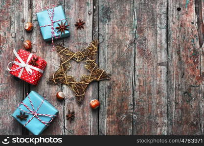 Box with Christmas gifts. Three boxes with Christmas gifts on retro wooden background