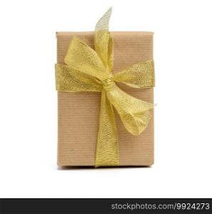 box wrapped in brown kraft paper and tied with golen ribbon, gift on white background