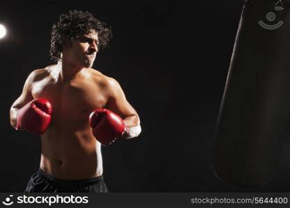 Boxer about to hit punching bag