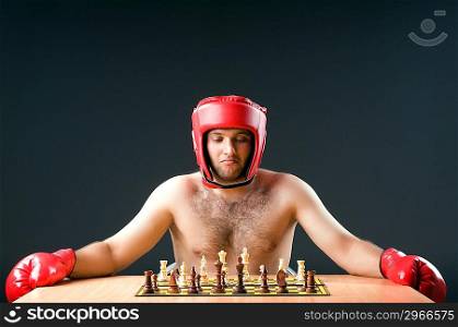 Boxer stuggling with chess game