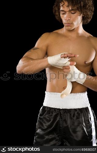 Boxer tying bandage
