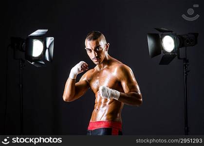 Boxer with studio lights in sports concept