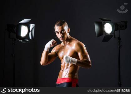 Boxer with studio lights in sports concept