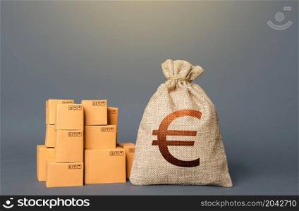 Boxes and Euro money bag. The concept of trade in goods and production. Business industry. Delivering. Profit from trading. Financial success. GDP and economy. Import export. Warehousing logistics.