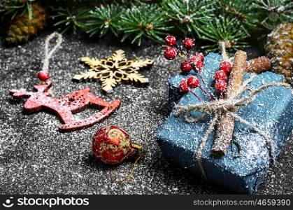 Boxes with Christmas gifts. Box with Christmas gift against fir and decorations