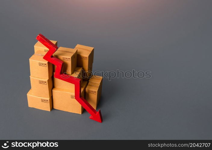 Boxes with goods and a red down arrow. Revenue drop in trade and transportation industry. Fall of the national economy, trade balance. Industrial production decline. Import export. Taxes and duties.