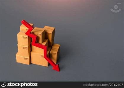 Boxes with goods and a red down arrow. Revenue drop in trade and transportation industry. Fall of the national economy, trade balance. Industrial production decline. Import export. Taxes and duties.