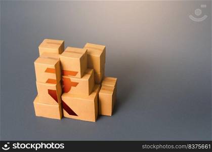 Boxes with indian rupee symbol. Distribution of goods. Transportation logistics. Manufacturing industry and trade. Gross Domestic Product, GDP. Retail. Consumption economics, imports and exports.