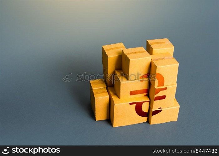 Boxes with ukrainian hryvnia symbol. Distribution of goods. Transportation logistics. Retail of products. Consumption economics, imports and exports. GDP. Manufacturing industry and trade.