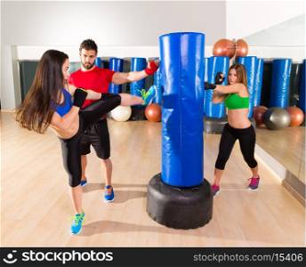 Boxing aerobox women group with personal trainer man at fitness gym