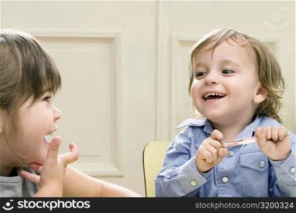 Boy and a girl looking at each other and smiling