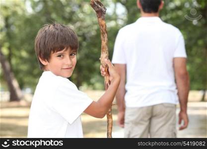 boy and adult in garden