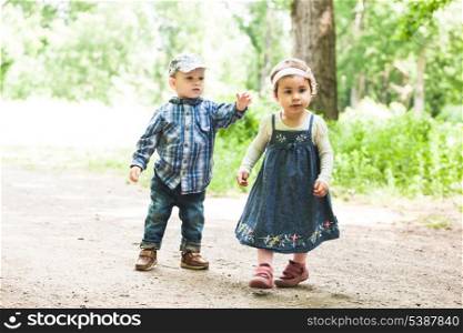 Boy and girl are playing in the park