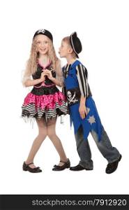 Boy and girl in fun poses on white background . Children dressed as pirate