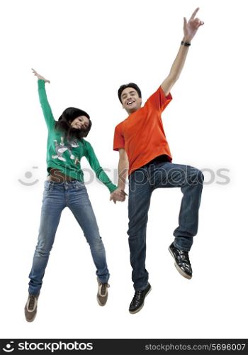 Boy and girl jumping in the air