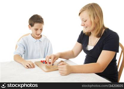 Boy and girl playing a game of Chinese checkers. Isolated on white.