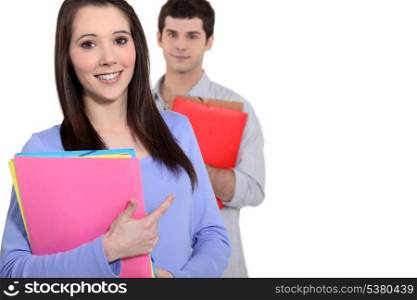 Boy and girl with folders