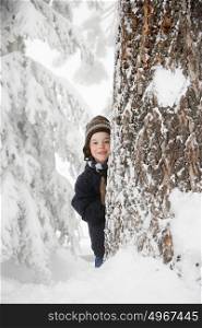 Boy and tree in the snow