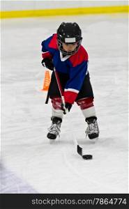 Boy at ice hockey practice