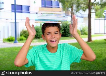 Boy balancing books on his head