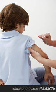 Boy being prepared to receive injection