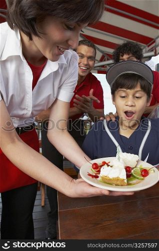 Boy celebrating his birthday in a restaurant