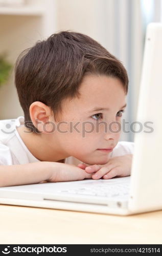 Boy Child Using Laptop Computer Resting on His Hands
