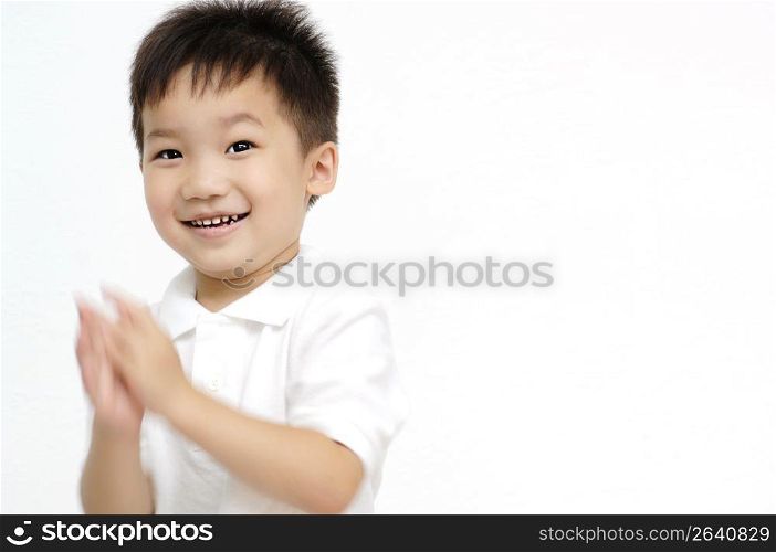 Boy claping a hand