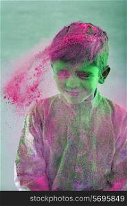 Boy covered with holi colour