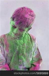 Boy covered with holi colour