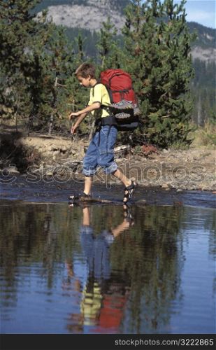 Boy Crossing the River