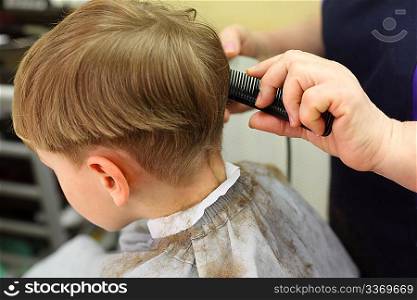 Boy cut in hairdressing salon