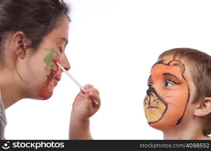 Boy doing an halloween make-up to his mom
