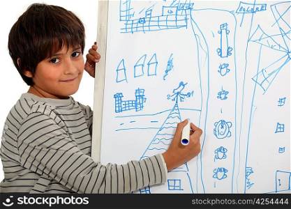 Boy drawing on a whiteboard