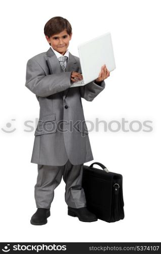 Boy dressed as a businessman
