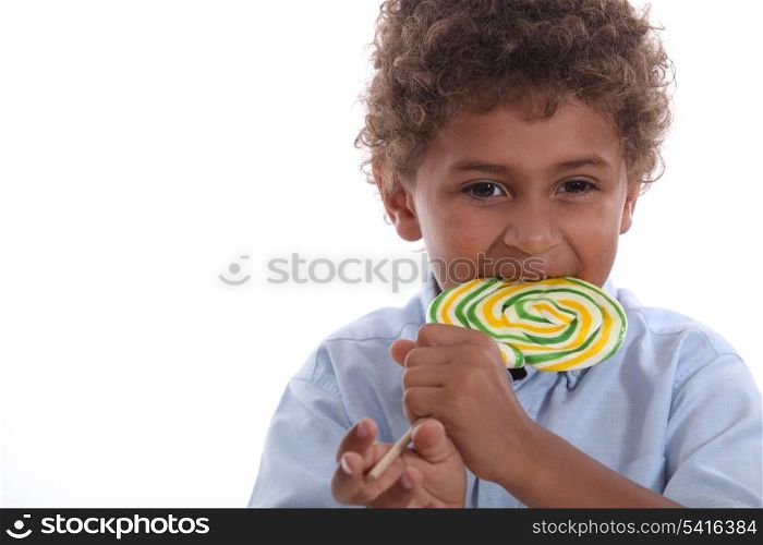 Boy eating a lolly pop