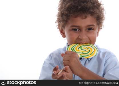 Boy eating a lolly pop