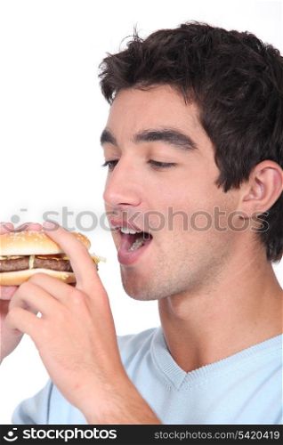 Boy eating hamburger