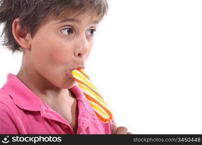 Boy eating lolly pop