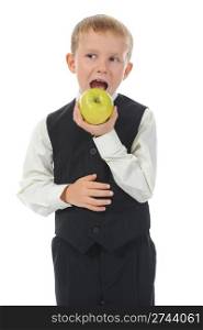Boy eats a green apple. Isolated on white background