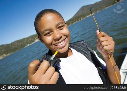 Boy Enjoying Fishing on Lake